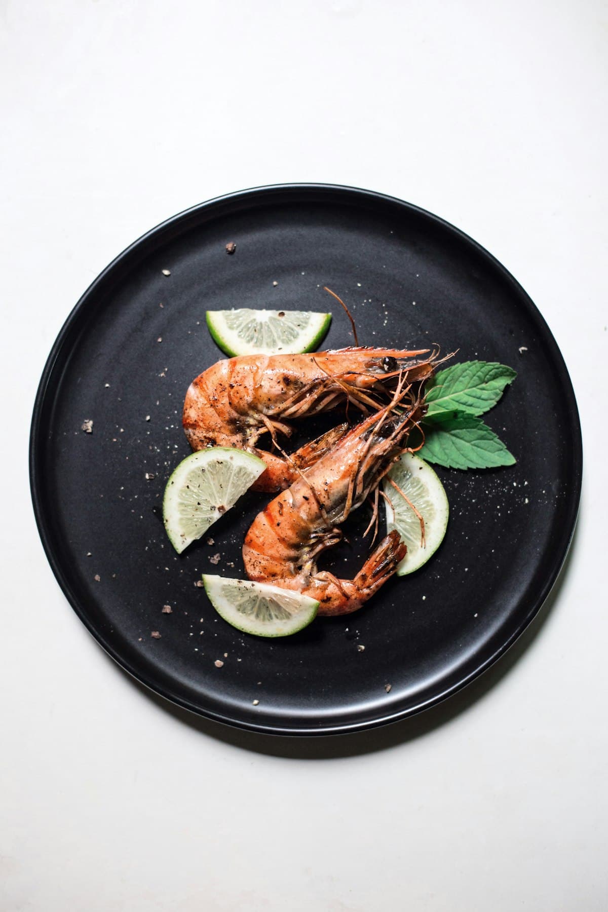 Raw head-on and headless Vannamei and Black Tiger prawns on ice